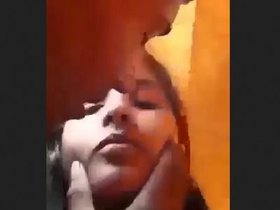 Two lovers engage in fervent kissing