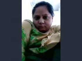 Aroused South Asian woman pleasuring herself