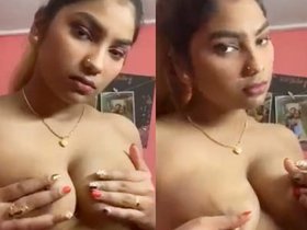 A seductive Desi girlfriend flaunts her breasts in a brief video