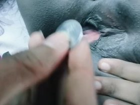 Indian beauty enjoys stimulation from a coin in her vagina
