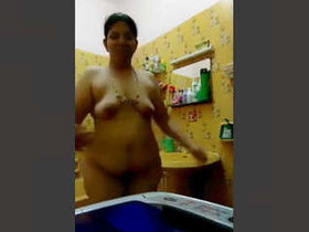 Indian milf's sensual bath performance