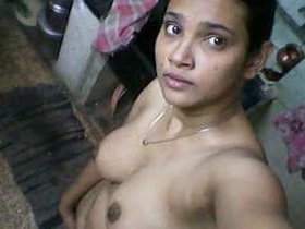 Young and charming Indian girl undressed for a bath