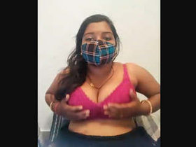 Sexy Indian housewife with big breasts performs live on webcam