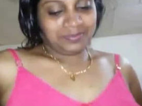 Desi X video featuring a mature Andhra woman with large breasts and explicit content