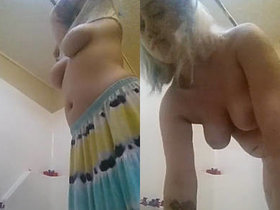 Indian girl with big breasts takes self-portraits in the bathtub