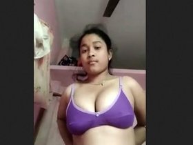 Asian teen girl flaunts her assets