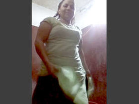Indian village woman undresses and pleasures herself in the tub