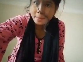 A seductive young woman displays her attractive physique