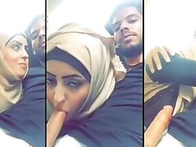 Horny young hottie in hijab giving her brother a blowjob