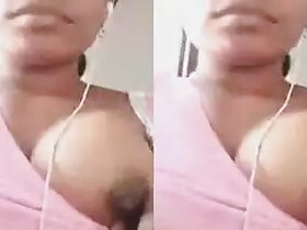 Pretty desi girl's breasts popping out, showing nipple