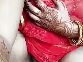 Shows off her big boobs through a red mesh sari while masturbating on StripChat