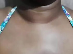 A teacher from Sri Lanka bathes in a sari and...