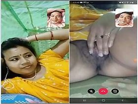 A horny Desi Bhabhi shows off licking her pussy and jerking off her hubby on Videocall