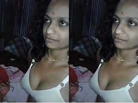 Desi Budi Sucking her tits and masturbating